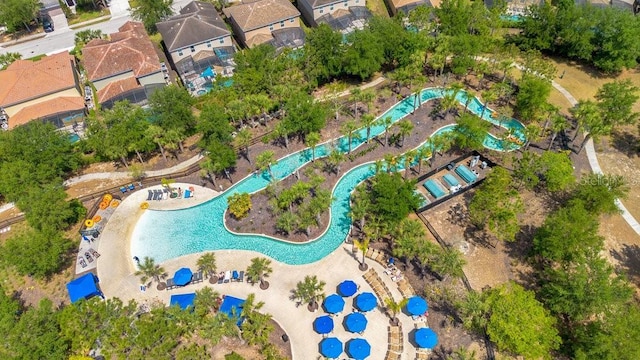 4060 Oak Tree Dr, Davenport, FL 33837 - aerial overview of property's location with a pool area and nearby suburban area