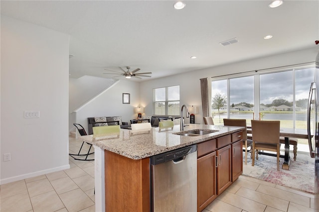 2430 Bittle Way, Saint Cloud, FL 34769 - kitchen featuring stainless steel dishwasher, light tile patterned floors, light stone counters, recessed lighting, and a ceiling fan