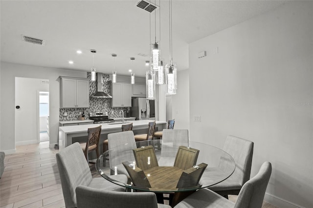 3336 Jackson Bluff Way, Clermont, FL 34711 - dining space with light wood finished floors and recessed lighting