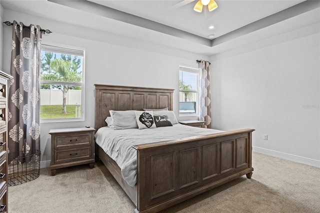 3336 Jackson Bluff Way, Clermont, FL 34711 - bedroom featuring light carpet, multiple windows, and a ceiling fan