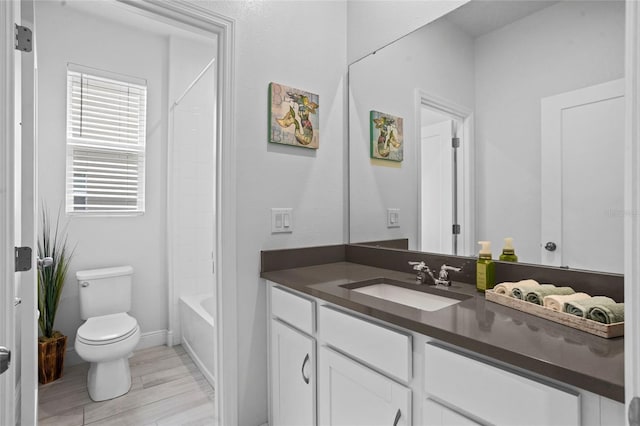 3336 Jackson Bluff Way, Clermont, FL 34711 - full bathroom with vanity, washtub / shower combination, and wood finished floors