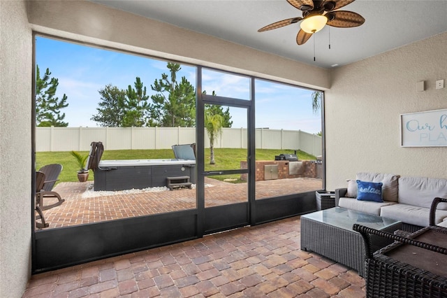 3336 Jackson Bluff Way, Clermont, FL 34711 - sunroom featuring a hot tub, a ceiling fan, and an outdoor hangout area