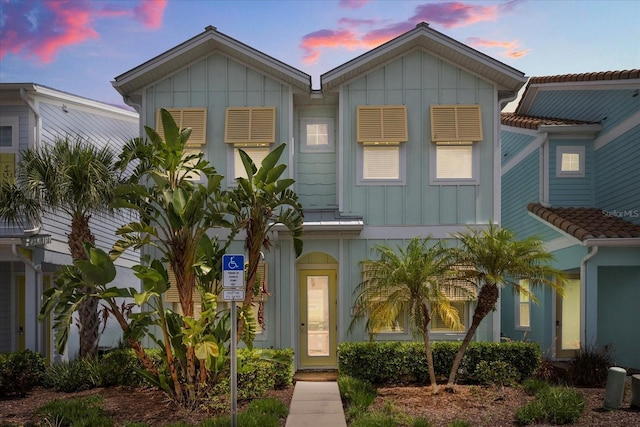 8017 Sandy Toes Way, Kissimmee, FL 34747 - view of front of home with board and batten siding