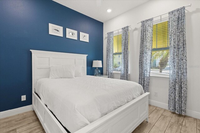8017 Sandy Toes Way, Kissimmee, FL 34747 - bedroom with recessed lighting and light wood-type flooring