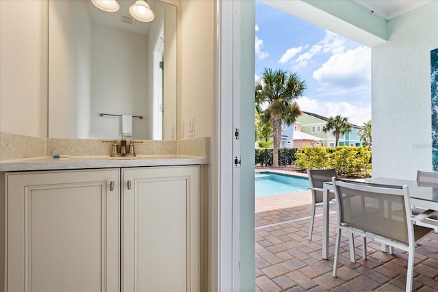 8017 Sandy Toes Way, Kissimmee, FL 34747 - bathroom with brick patterned flooring and vanity