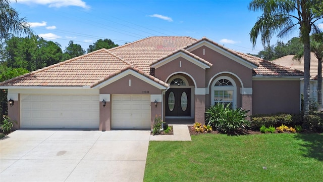11031 Ledgement Ln, Windermere, FL 34786 - mediterranean / spanish-style home featuring a garage, stucco siding, driveway, and a tiled roof
