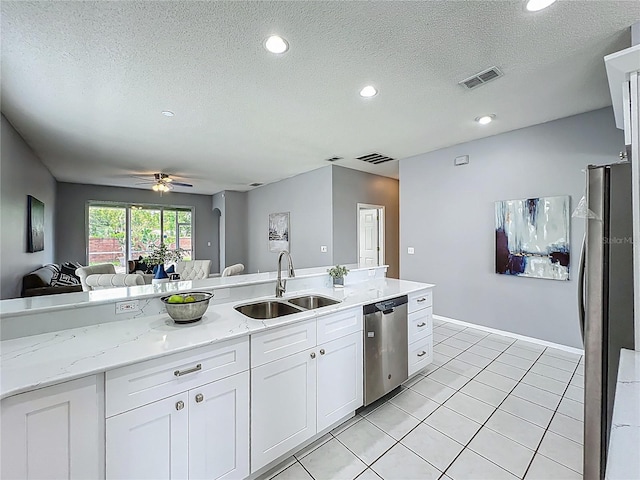 5754 Magnolia Bloom Ter, Oviedo, FL 32765 - kitchen featuring appliances with stainless steel finishes, open floor plan, white cabinets, ceiling fan, and recessed lighting