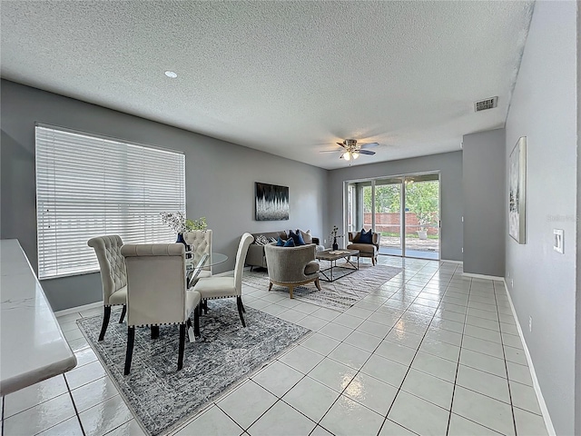 5754 Magnolia Bloom Ter, Oviedo, FL 32765 - dining area featuring a textured ceiling, ceiling fan, and light tile patterned flooring