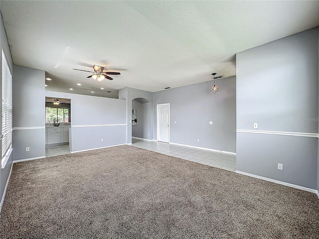 5754 Magnolia Bloom Ter, Oviedo, FL 32765 - empty room featuring arched walkways, ceiling fan, light colored carpet, light tile patterned floors, and recessed lighting