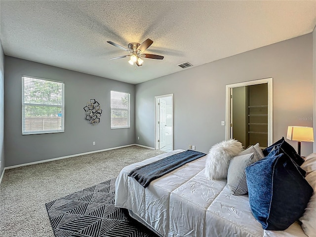 5754 Magnolia Bloom Ter, Oviedo, FL 32765 - bedroom featuring carpet flooring, ceiling fan, a textured ceiling, and ensuite bathroom