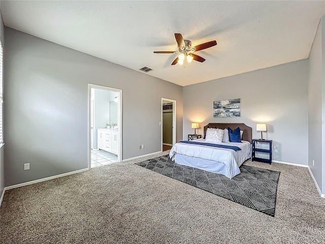 5754 Magnolia Bloom Ter, Oviedo, FL 32765 - carpeted bedroom with a ceiling fan, ensuite bath, and a textured ceiling