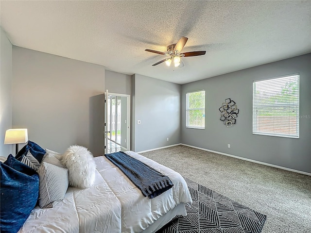 5754 Magnolia Bloom Ter, Oviedo, FL 32765 - bedroom featuring carpet flooring, a textured ceiling, a ceiling fan, and access to exterior