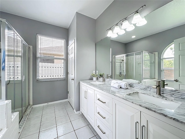 5754 Magnolia Bloom Ter, Oviedo, FL 32765 - full bath featuring double vanity, a shower stall, and tile patterned floors