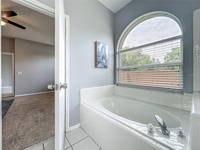 5754 Magnolia Bloom Ter, Oviedo, FL 32765 - bathroom featuring a garden tub, a ceiling fan, and tile patterned floors