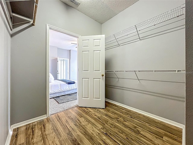 5754 Magnolia Bloom Ter, Oviedo, FL 32765 - spacious closet featuring wood finished floors and lofted ceiling