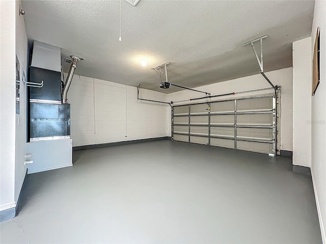 5754 Magnolia Bloom Ter, Oviedo, FL 32765 - garage featuring a garage door opener and baseboards