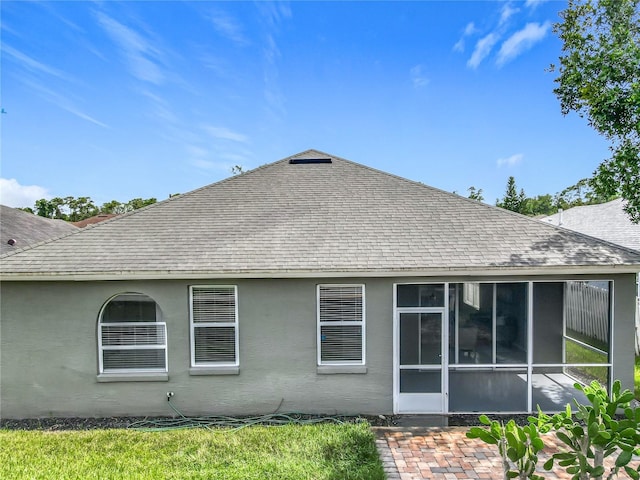 5754 Magnolia Bloom Ter, Oviedo, FL 32765 - rear view of property with a shingled roof and a sunroom