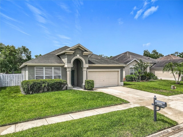 5754 Magnolia Bloom Ter, Oviedo, FL 32765 - ranch-style house with stucco siding, a garage, driveway, and a shingled roof