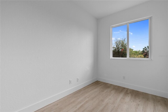13438 Mcintosh Ave, Port Charlotte, FL 33981 - spare room with baseboards and light wood-style floors