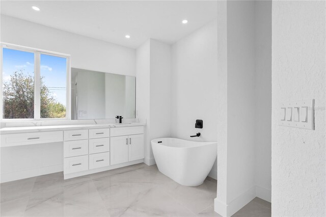 13438 Mcintosh Ave, Port Charlotte, FL 33981 - full bathroom with vanity, a freestanding bath, recessed lighting, and marble finish flooring