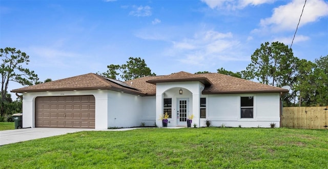 7450 Franzino Ave, North Port, FL 34291 - ranch-style house featuring stucco siding, an attached garage, concrete driveway, roof mounted solar panels, and a shingled roof