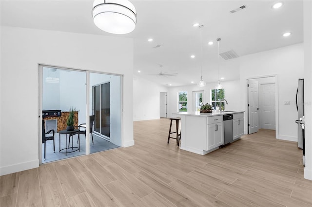 7450 Franzino Ave, North Port, FL 34291 - kitchen with stainless steel dishwasher, open floor plan, light countertops, ceiling fan, and recessed lighting