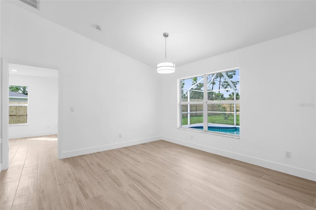 7450 Franzino Ave, North Port, FL 34291 - empty room featuring light wood-type flooring