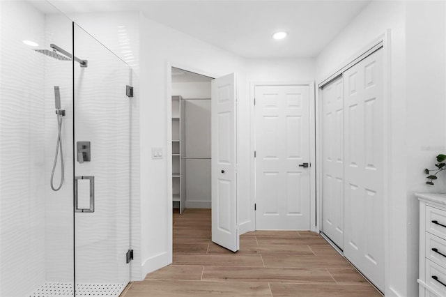 7450 Franzino Ave, North Port, FL 34291 - full bathroom with a closet, a shower stall, wood finished floors, and recessed lighting