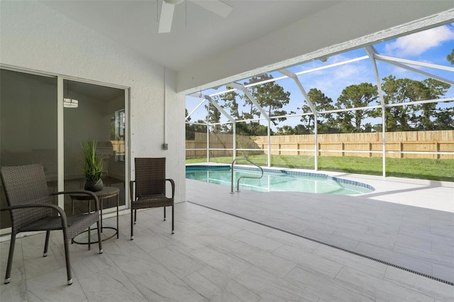 7450 Franzino Ave, North Port, FL 34291 - view of swimming pool with a patio area, a ceiling fan, and a lanai