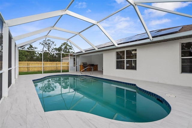 7450 Franzino Ave, North Port, FL 34291 - view of swimming pool with a patio area, a grill, and a lanai