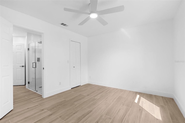 7450 Franzino Ave, North Port, FL 34291 - unfurnished bedroom featuring light wood finished floors, a ceiling fan, and a closet