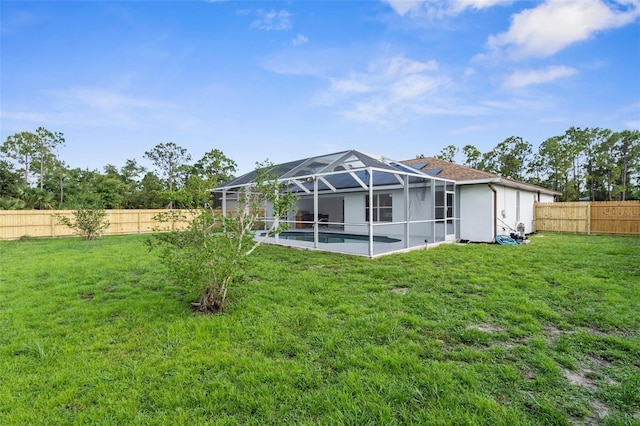 7450 Franzino Ave, North Port, FL 34291 - back of house featuring a fenced backyard and a lanai