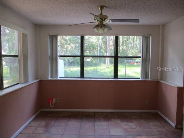 5304 Galloway Rd, Apopka, FL 32712 - unfurnished room with plenty of natural light, a ceiling fan, and a textured ceiling