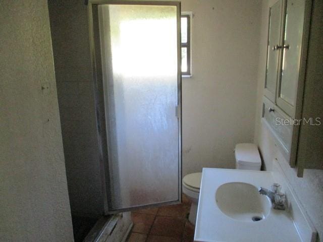 5304 Galloway Rd, Apopka, FL 32712 - bathroom featuring vanity, a stall shower, and tile patterned flooring