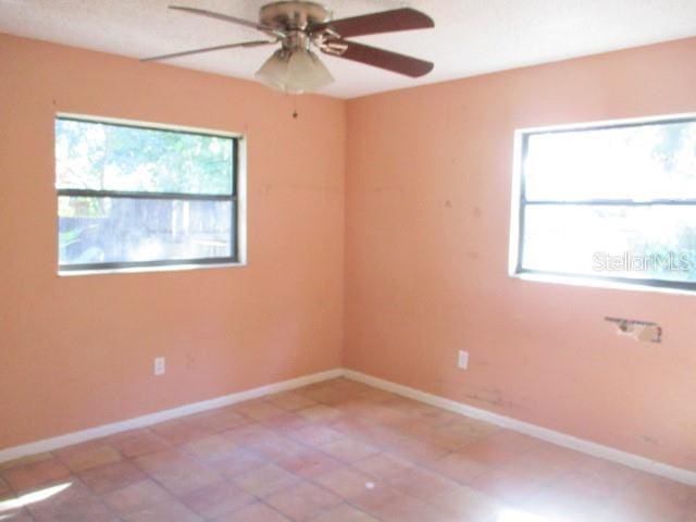 5304 Galloway Rd, Apopka, FL 32712 - tiled spare room with ceiling fan and baseboards