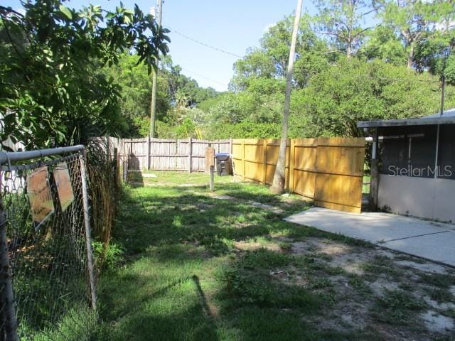 5304 Galloway Rd, Apopka, FL 32712 - fenced backyard with a patio area