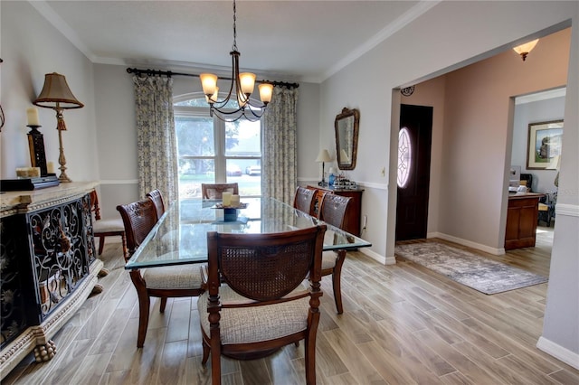 1624 Bear Crossing Cir, Apopka, FL 32703 - dining area with a chandelier, light wood finished floors, and crown molding