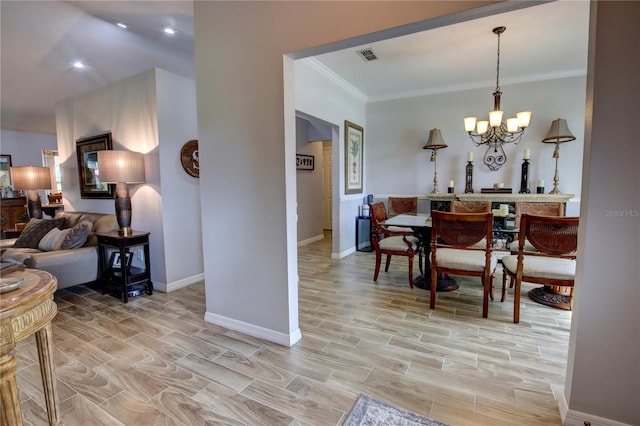 1624 Bear Crossing Cir, Apopka, FL 32703 - dining room featuring a chandelier, crown molding, and light wood-style flooring
