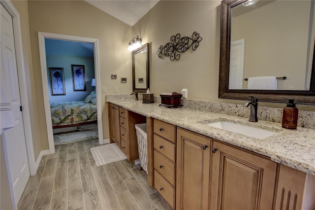 1624 Bear Crossing Cir, Apopka, FL 32703 - bathroom with double vanity, ensuite bathroom, and wood finished floors
