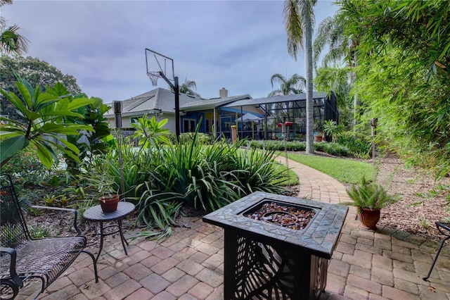 1624 Bear Crossing Cir, Apopka, FL 32703 - view of patio with a fire pit and glass enclosure