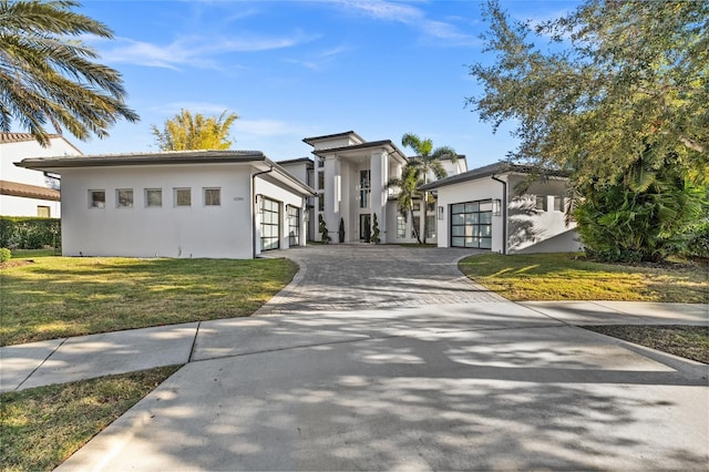 12264 Montalcino Cir, Windermere, FL 34786 - view of front of house with driveway, an attached garage, stucco siding, and a front yard