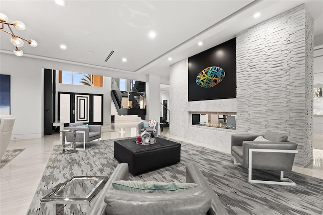 12264 Montalcino Cir, Windermere, FL 34786 - living room featuring recessed lighting, stairway, a multi sided fireplace, and a chandelier