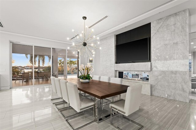 12264 Montalcino Cir, Windermere, FL 34786 - dining area featuring a chandelier, a multi sided fireplace, and light tile patterned flooring