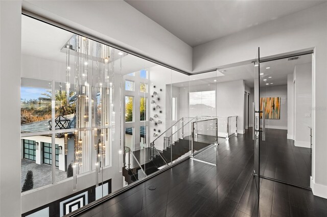 12264 Montalcino Cir, Windermere, FL 34786 - staircase featuring wood finished floors and a towering ceiling