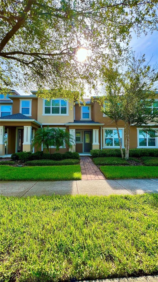 8625 Coventry Park Way, Windermere, FL 34786 - townhome / multi-family property featuring stucco siding and a front lawn