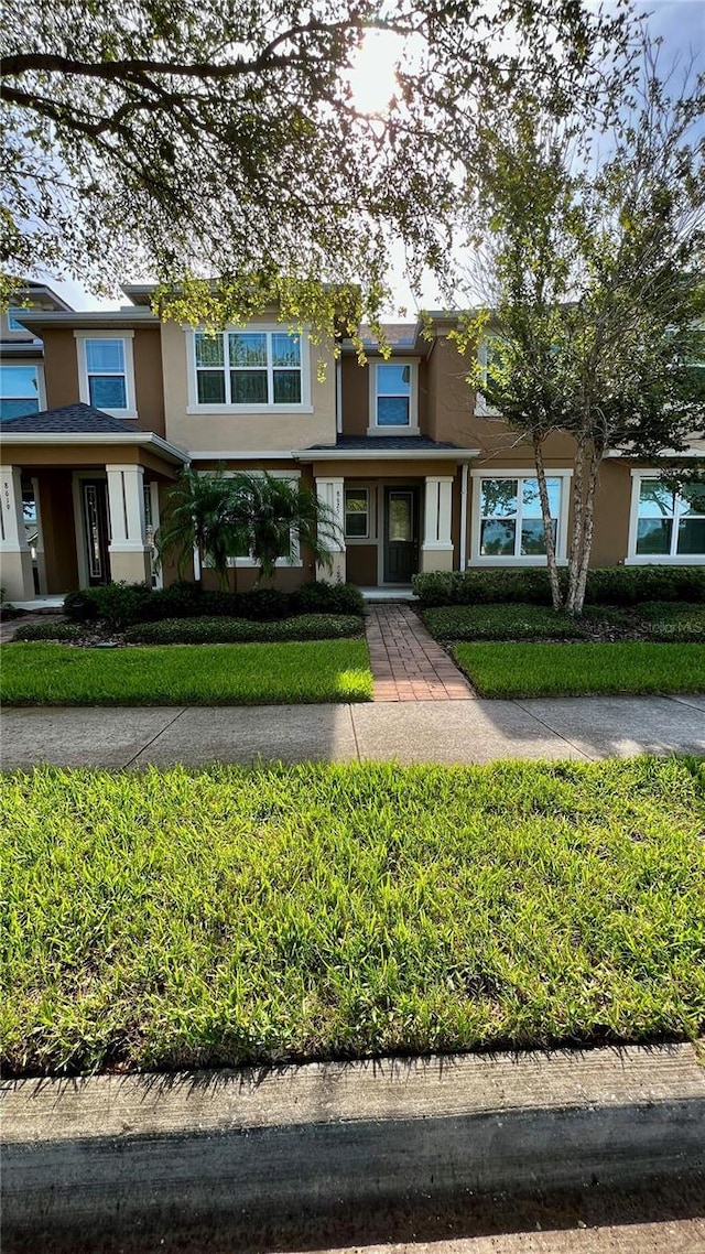 8625 Coventry Park Way, Windermere, FL 34786 - view of property with stucco siding and a front yard
