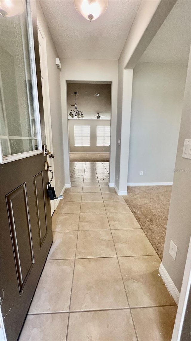 8625 Coventry Park Way, Windermere, FL 34786 - hall featuring a textured ceiling and light tile patterned floors