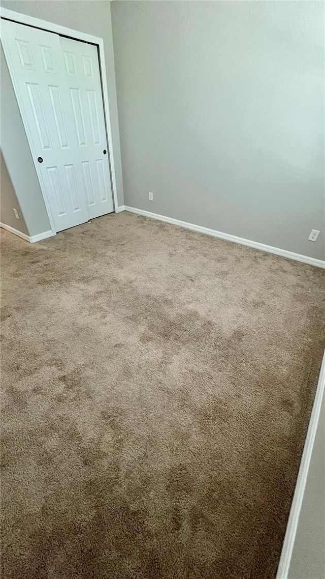 8625 Coventry Park Way, Windermere, FL 34786 - unfurnished bedroom featuring carpet floors and a closet
