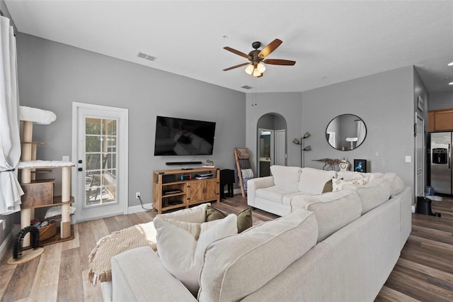 962 Ashworth Overlook Dr Unit C, Apopka, FL 32712 - living area with arched walkways, ceiling fan, and wood finished floors