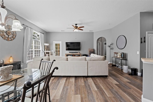 962 Ashworth Overlook Dr Unit C, Apopka, FL 32712 - living area with arched walkways, a ceiling fan, and wood finished floors